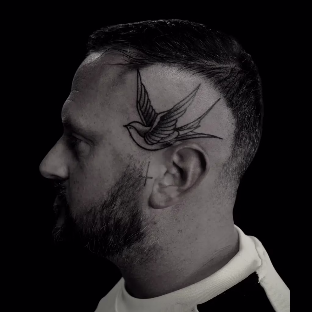 side of Head Swallow Tattoo – The Viper Pit, Irlam
