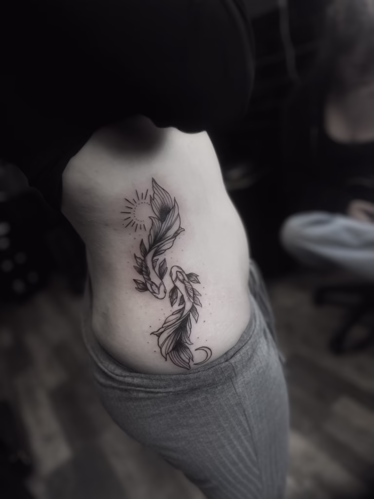 Fresh koi fish tattoo on Nieve’s ribs at The Viper Pit Tattoo Studio in Manchester during a summer heatwave