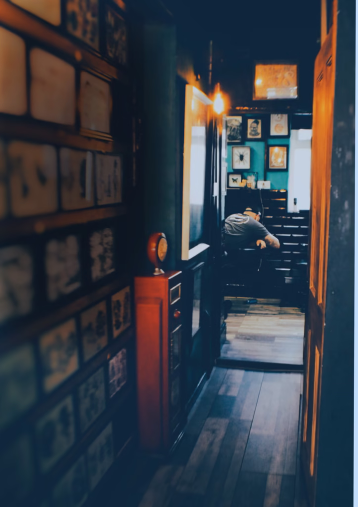 Client receiving a custom tattoo from an artist at The Viper Pit in Irlam, Manchester