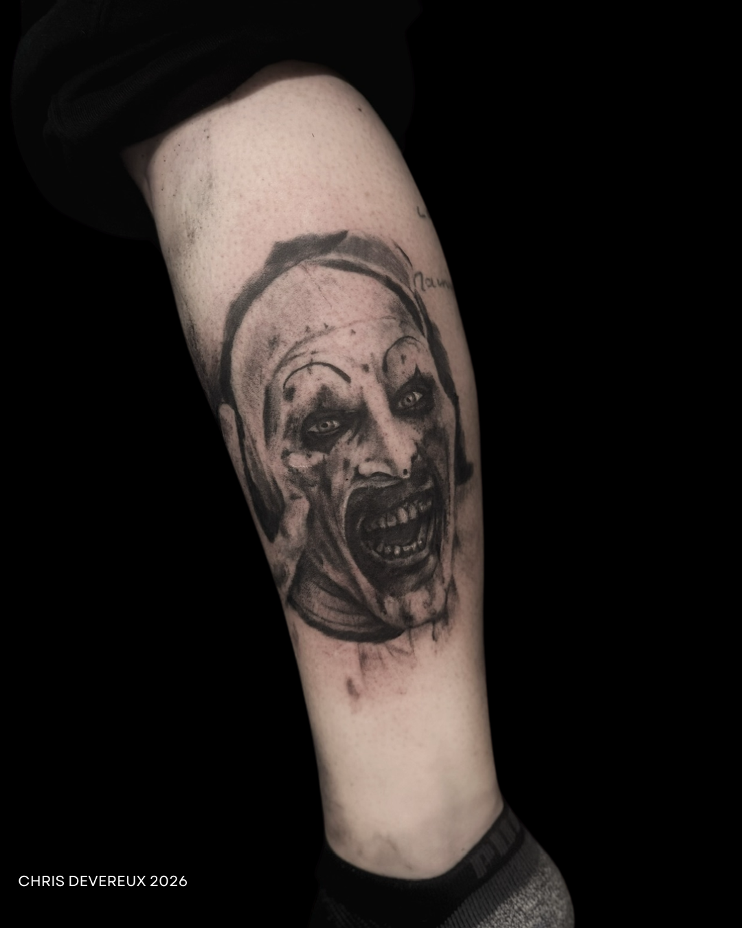 Realistic skull tattoo on forearm.